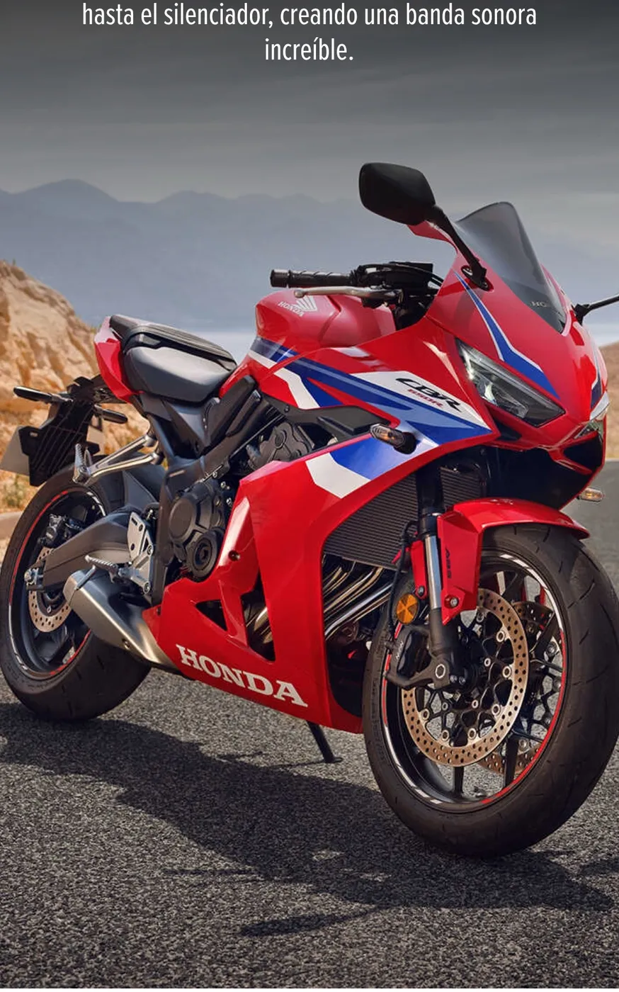Motocicleta Honda CBR deportiva roja con carenado completo